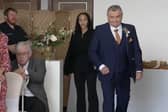 Neil Crossley walks down the aisle at his daughter's wedding, forgetting to take her with him.