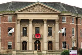 A Sunday service led by The Very Revd Dr Peter Robinson, Dean of Derby is part of Remembrance commemorations this year. (Pictured is Derby City Council adorned with a giant poppy.)