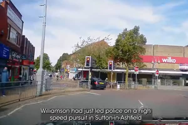 Dangerous driver narrowly avoids hitting woman with a pram.