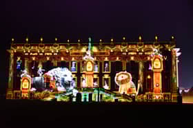 Chatsworth House is now ready and open for the public to enjoy its Christmas theme. Pictured is the front of the house with a light projection of a scene from the story Henry And The Lion's Christmas Feast.