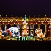 Chatsworth House is now ready and open for the public to enjoy its Christmas theme. Pictured is the front of the house with a light projection of a scene from the story Henry And The Lion's Christmas Feast.