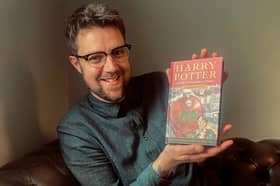 Expert Jim Spencer, with the Harry Potter first edition bought by Christine McCulloch after watching Blue Peter in 1997