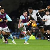 Derby County secured a point at promotion-chasing Burnley who were booed off at full-time