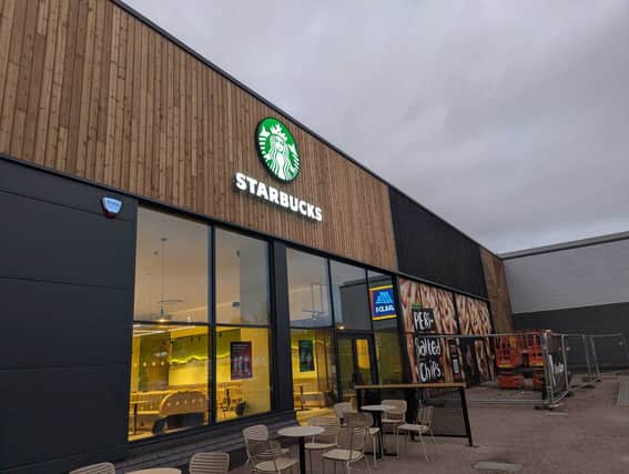 A new Starbucks shop has opened while work starts on a new Nando's at a Derby retail park.