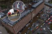 Car are flooded outside a newly converted Meadow Mill on Water street in Stockport as emergency teams arrive to rescue people trapped inside. January 1 2025.