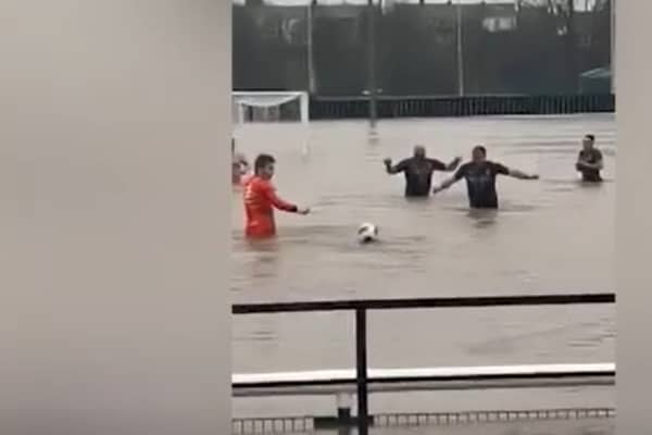 Lydney Town AFC players swim in flooded pitch