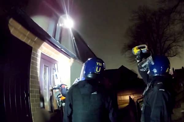 Police used a chainsaw to raid a drug house where they arrested a 13-year-old boy on suspicion of having a zombie knife. 