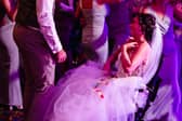 A bride given less than six months to live after losing her leg to cancer made it down the aisle to marry her partner -for the second time. 