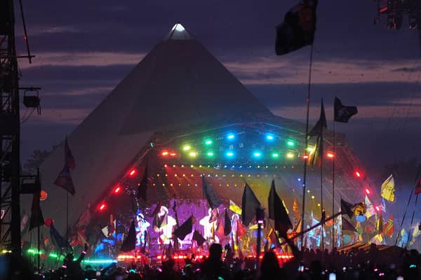 The crowd watching Coldplay performing on the Pyramid Stage at the Glastonbury Festival