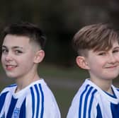 Flo Topham (L) and Camille Porhel, who play for York Railway Institute (YRI) AFC u12s Girls, have launched a campaign defending their right to have short hair, after they were accused of being boys during a game. 