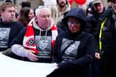 Harvey Willgoose's parents Mark Willgoose (left), and Caroline outside Sheffield Town Hall as they prepared to march to Bramall Lane in memory of their son last weekend