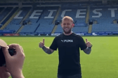 Photo of Matthew getting his photo taken in a Premier League football stadium