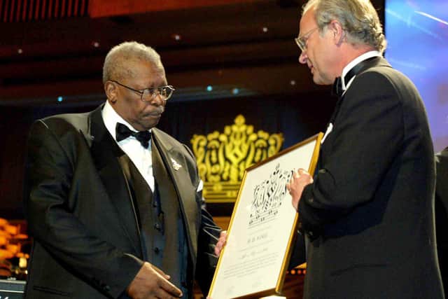 US blues legend B.B. King (L) receives the Polar Music Prize, The Royal Swedish Academy of Music Award 2004, from King Carl XVI Gustaf of Sweden at a gala ceremony in Stockholm, 24 May 2004.