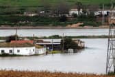 Houses in the middle of a flooded area after Storm Laurence passed through El Palmar de Troya in southern Spain, before Martinho swept in.
