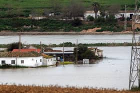 Houses in the middle of a flooded area after Storm Laurence passed through El Palmar de Troya in southern Spain, before Martinho swept in.