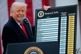 President Donald Trump holds up a chart of "reciprocal tariffs" while speaking during a trade announcement event in the Rose Garden at the White House.