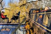 A dad is raising his sons on boats - with 'cinema' and study nook.