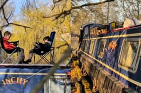 A dad is raising his sons on boats - with 'cinema' and study nook.