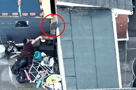 Drug dealer lobs bin bag of heroin over fence during police raid