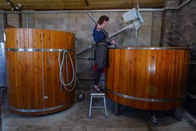 Gin distiller Mel prepares the next batch of gin at the highest-altitude distillery in the UK, standing at 1,689 feet above sea level, is the Forest Distillery, located at the Cat & Fiddle Inn
