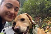 Rebecca McBride, chaperoning a dog.