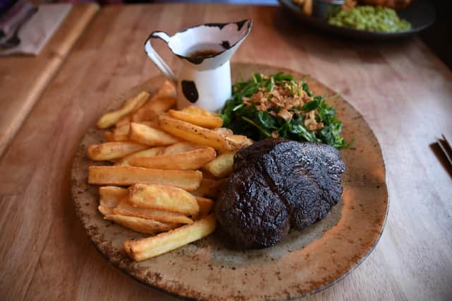 Gorgeously burnished, medium rare steak with peppercorn sauce was a hit at the table