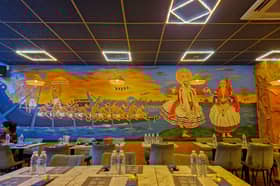 Aalappeaz is one of the newest eateries that has opened in Derby. Pictured is a shot from the interior showing South Indian artistry adorning the restaurant walls.