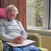 Jane Richards, reading her father's sermon. 