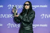 Charli XCX, winner of the Songwriter of the Year award, poses in the winners room at the Ivor Novello Awards 2025 at Grosvenor House on May 22, 2025 in London, England.