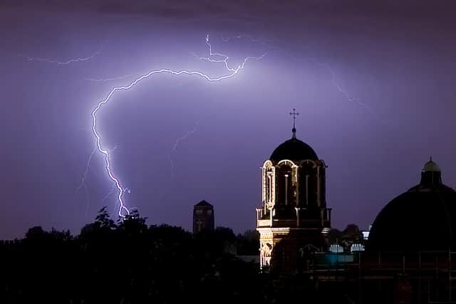 Lightning flashes in the night sky over South London.