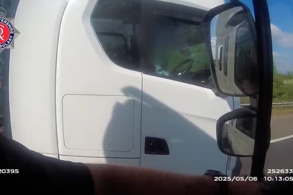 Lorry driver caught rolling cigarette with no hands on wheel