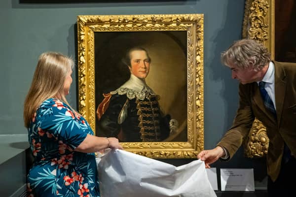 Susannah Stewart, representative of the Hall family, and Tony Butler, Derby Museums’ Executive Director, unveil the Joseph Wright artwork, painted circa 1760.