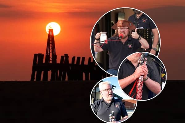 A popular sea shanty crew lead a boozy sunset sing-along outside an RNLI station