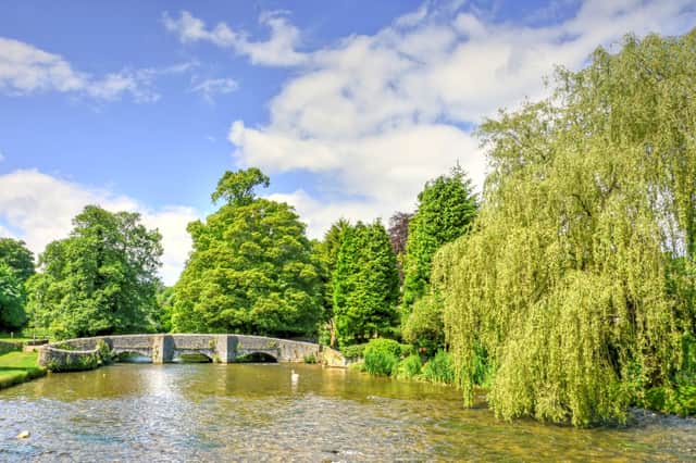 Sitting pretty on the River Wye is Ashford-in-the-Water, which Countryfile refers to as 'possibly the Peak's prettiest village'.
Here is the medieval Sheepwash Bridge, a serene spot filled with sweeping willow trees. The location was also named by VisitEngland as top spot to play traditional game of Poohsticks.