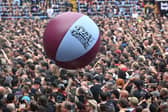 The Villa Park crowd plays with a huge beach ball as they watch support acts, during British rock band Black Sabbath's "Back to The Beginning" concert, Ozzy Osbourne's final ever gig as Black Sabbath's frontman at Villa Park in Birmingham