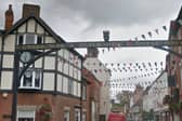 The Black's Head sculpture on the listed sign above St John's Street in Ashbourne before its removal