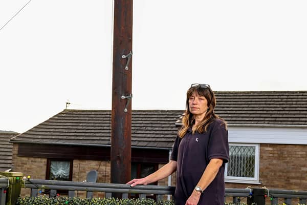 Mum-of-two Tracey Crarer was left stunned when she returned home from work one day to find workmen had removed her fence panel and had started installing the pole without any prior consultation.