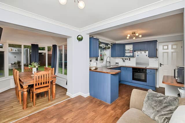 The dining kitchen forms the social heart of the home with easy access to the garden for everyday family life.
