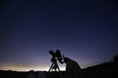Members of the York Astronomical Society prepare to view the annual Perseids meteor shower in the village of Rufforth, near York, northern England on 12 August 2015.