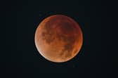 The blood Moon is pictured during an eclipse in the night sky in Shanghai on 8 September 2025.