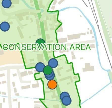 A close up view of the Buildings at Risk app, showing the colour-coding system.