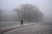 Person runs in frosty weather.