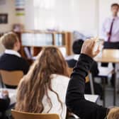 Student puts their hand up.