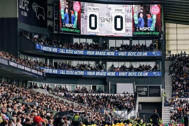 NSPCC Childhood Day images and messages on display alongside match scores.