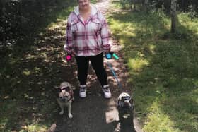 Zoe walking two dogs