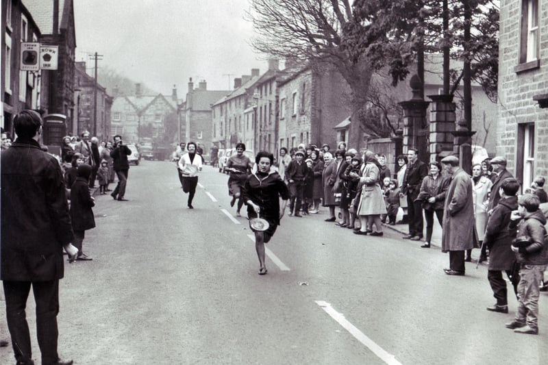 Janet Wright streaks to an easy victory in the ladies open Pancake Race at Winster, Derbyshire, 7th February 1967