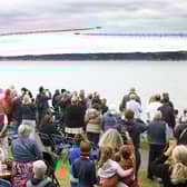 The Red Arrows dazzle spectators with their diamond nine aerobatic display across the shores of Belfast Lough