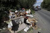 Fly-tipped rubbish and waste is seen beside a road in Colnbrook, near Heathrow, west of London on May 11 2020.