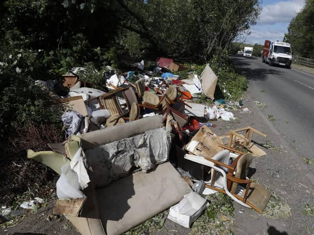 Fly-tipped rubbish and waste is seen beside a road in Colnbrook, near Heathrow, west of London on May 11 2020.