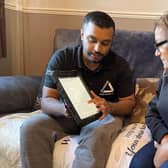 Green Doctor Fayad and Neena looking at online information to save money.